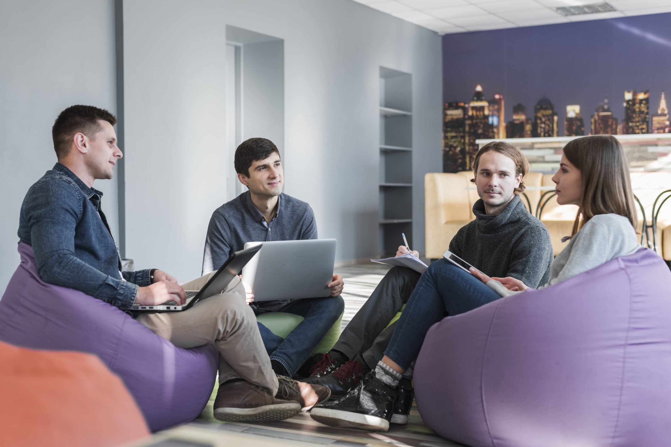 Modular office couch furniture with ottoman and corner units arranged in L-shape for team space