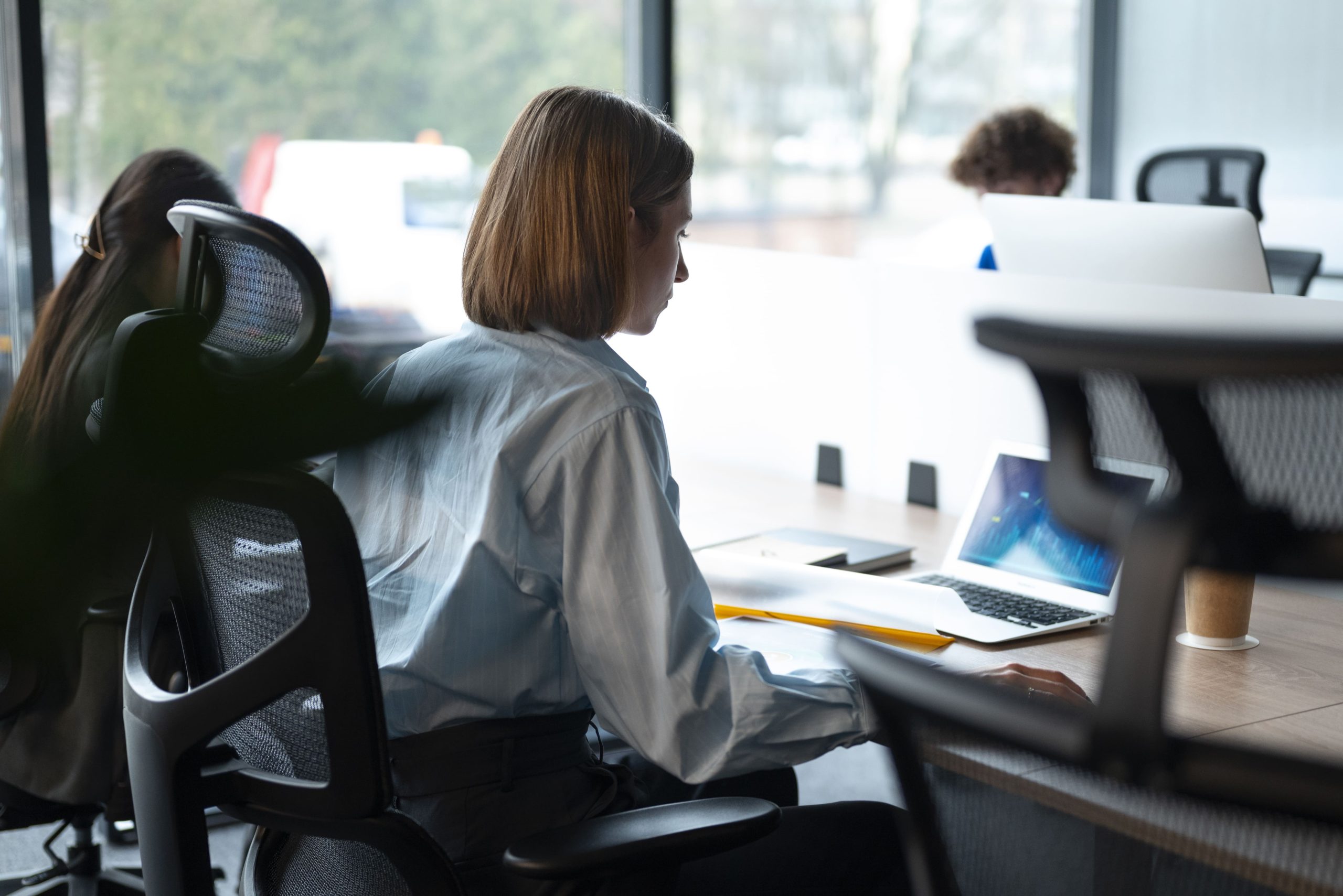 Adjustable ergonomic office chairs in open-plan office environment