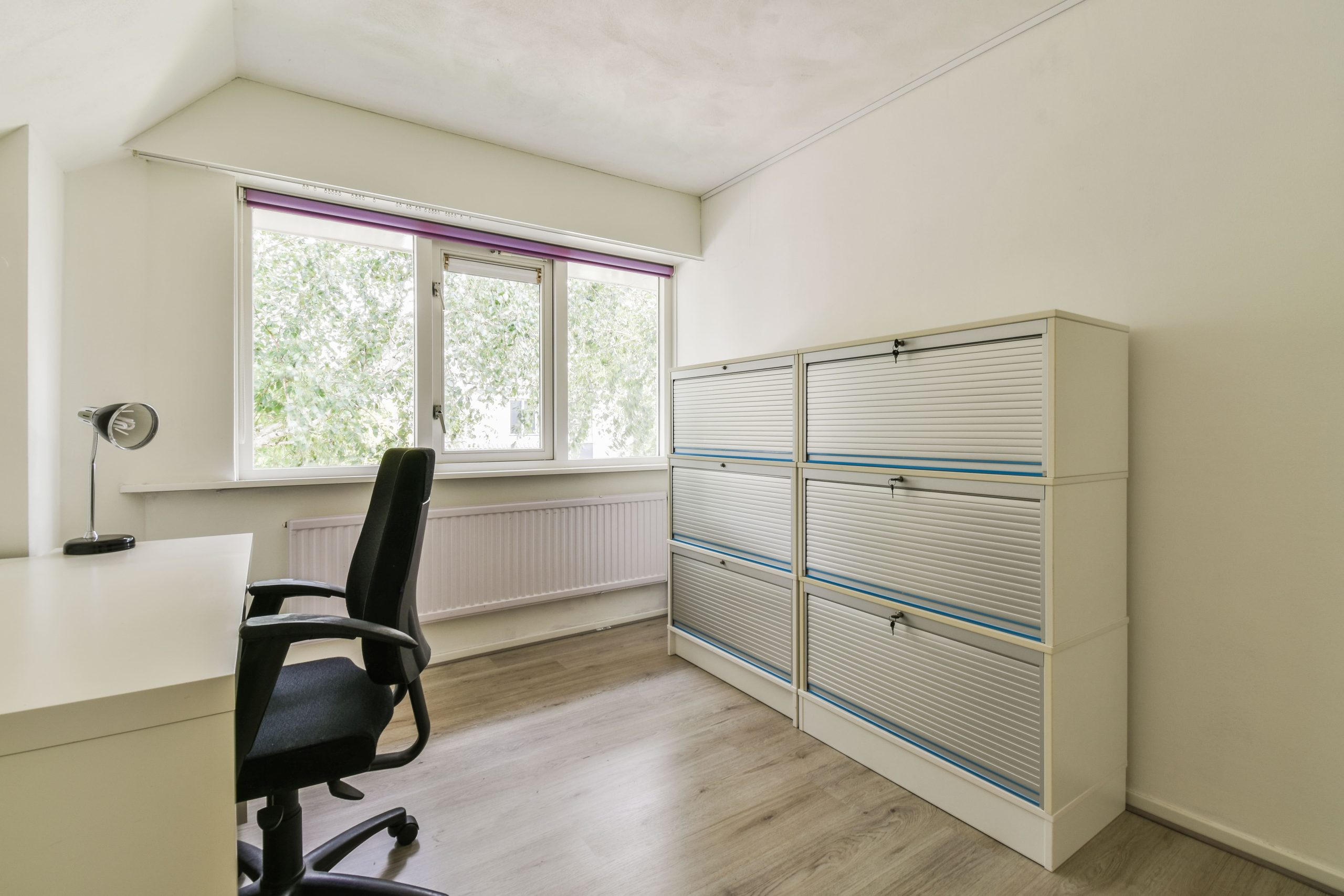 Modern office furniture file cabinets, lateral style with multiple drawers and anti-tip lock for shared office storage